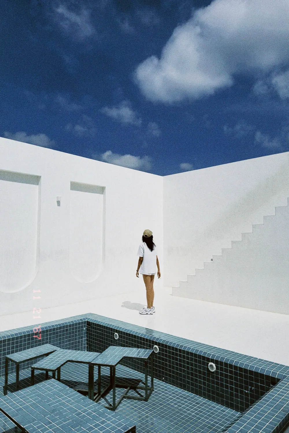 White architecture around a tiled pool